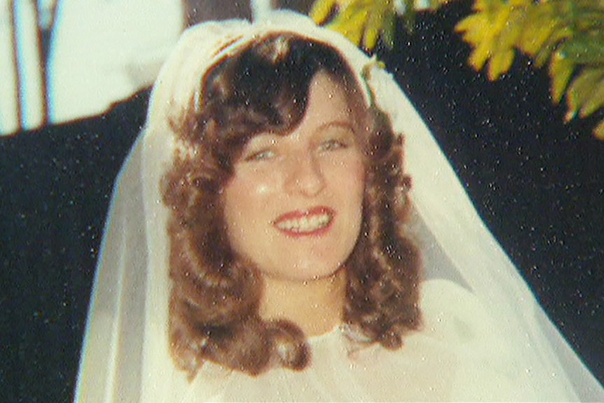 A grainy image of a smiling Linda Reed in a wedding veil.