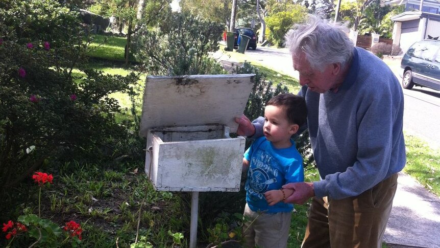 Edward with his grandson getting the mail.