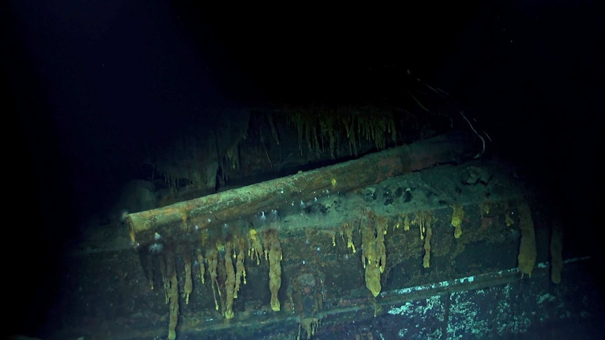 A screenshot from an underwater video capturing the ship wreck of a world war two Japanese warship