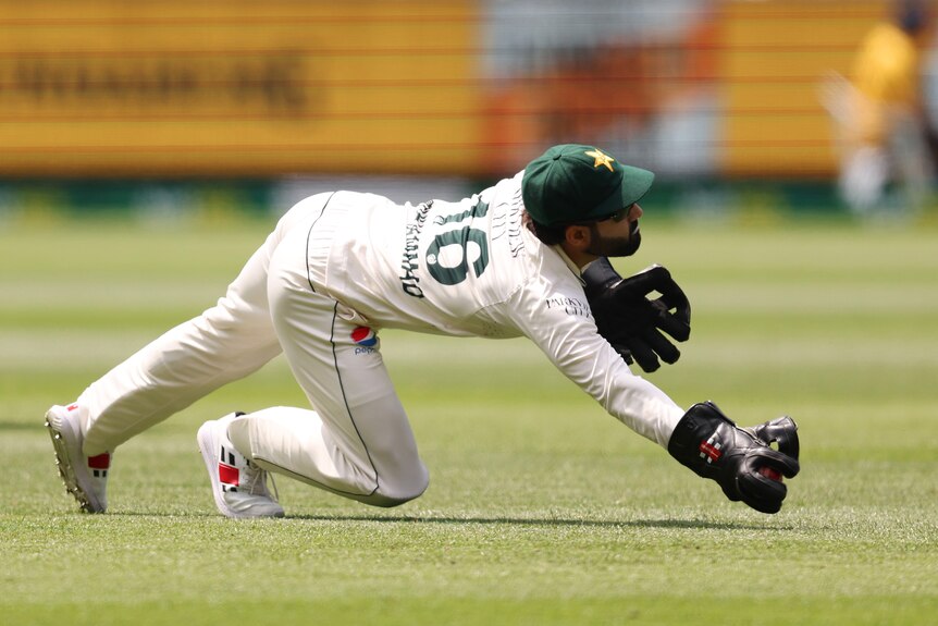 Mohammad Rizwan takes a diving catch
