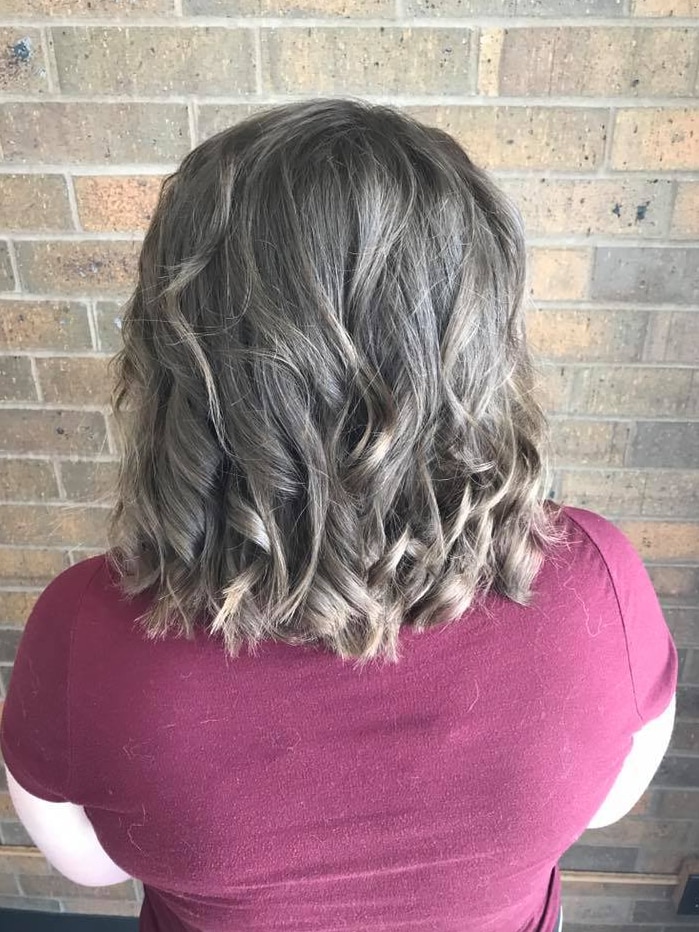 Back of teen's hair after it has been cut and curled