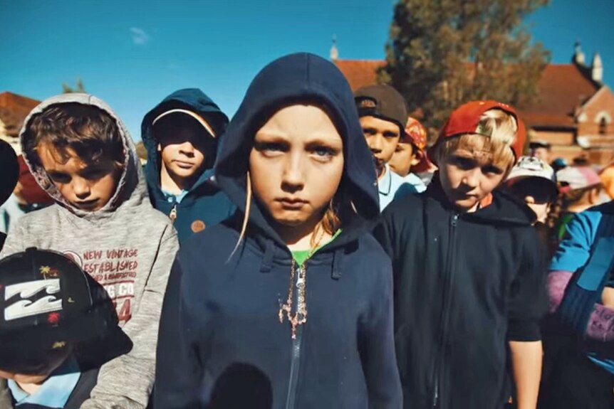 A still image from Coraki Public School's YouTube hip hop clip showing students in hooded jumpers