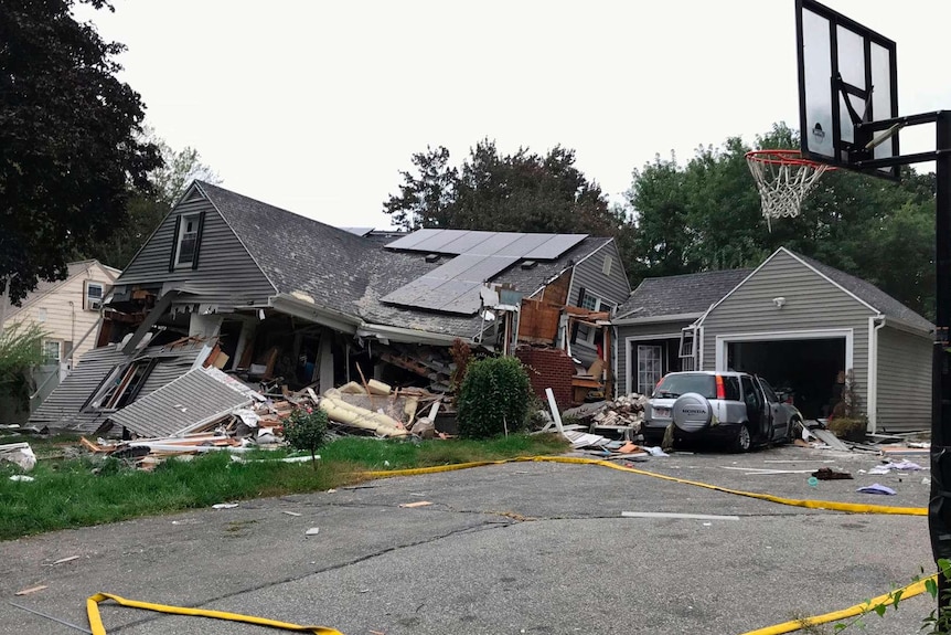 The side view of a house that collapses as a result of a gas explosion in Lawrence near Boston.