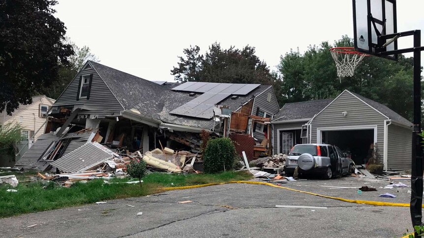 The side view of a house that collapses as a result of a gas explosion in Lawrence near Boston.