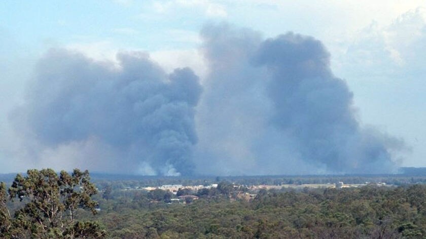 Smoke rises up from a bushfire in the Londonderry area of north-west Sydney