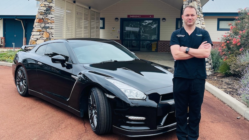 man in front of a car