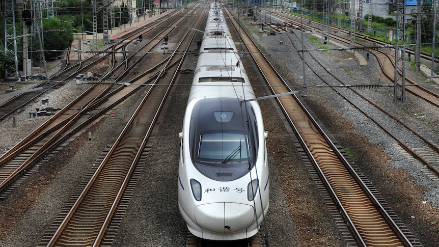 A China Railway High-speed (CRH) Harmony bullet train pulls into the Shenyang Railway Station in Shenyang, Liaoning province on July 31, 2012. China will hike railway spending by 64 billion yuan ($10 billion) to 580 billion yuan in 2012, the Ministry of Railways said.