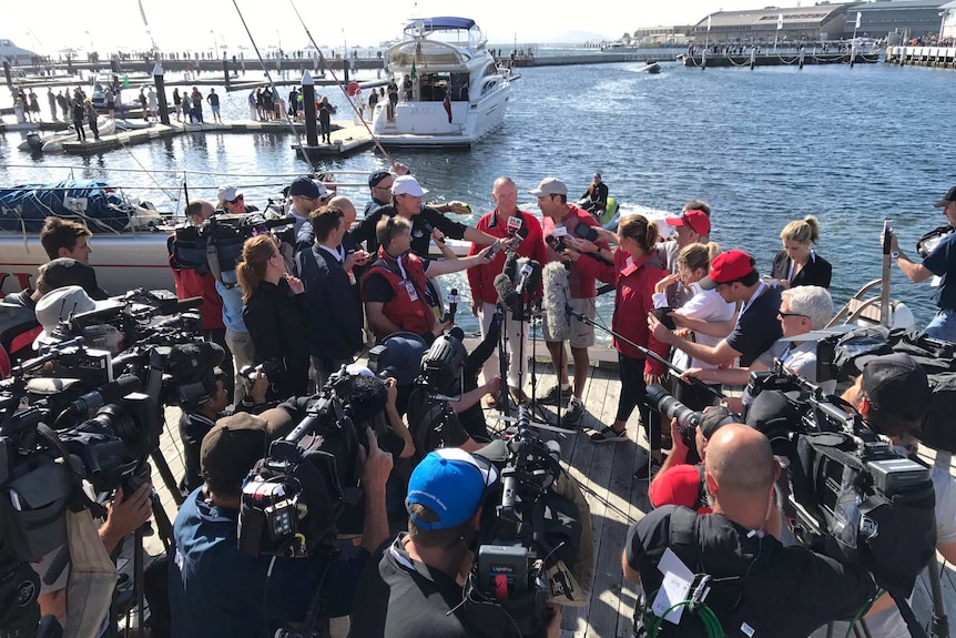 The Wild Oats XI crew speak to the media after their line honours win.