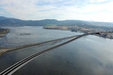 Existing Bridgewater Bridge next to artist's concept of new bridge.