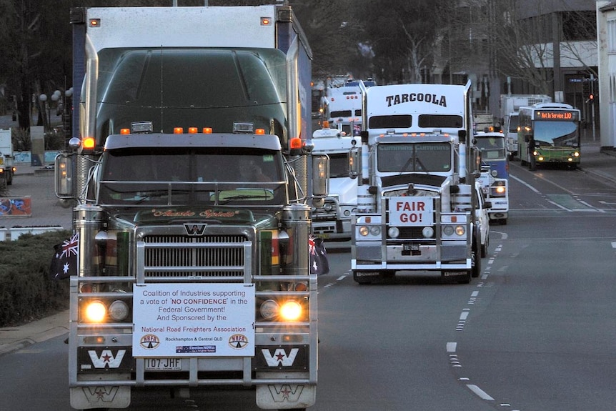 A convoy of trucks protesting against the carbon tax make their through the Canberra CBD