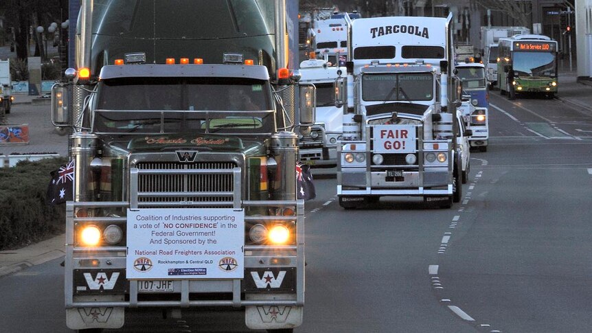 A convoy of trucks protesting against the carbon tax make their through the Canberra CBD