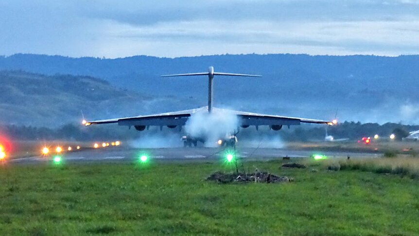An RAAF C-17 Globemaster carrying Australian Aid lands in the Solomon Islands.