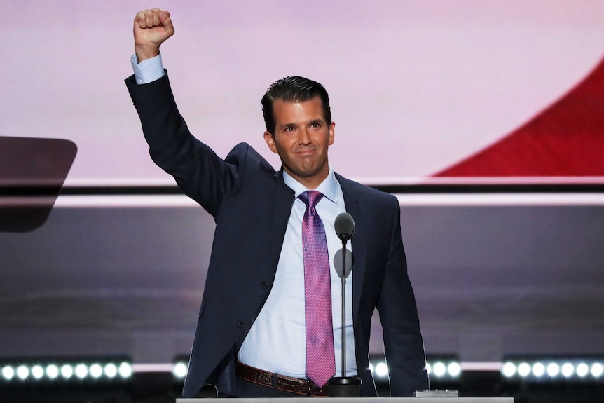 Donald Trump Jr gestures to the Republican crowd.