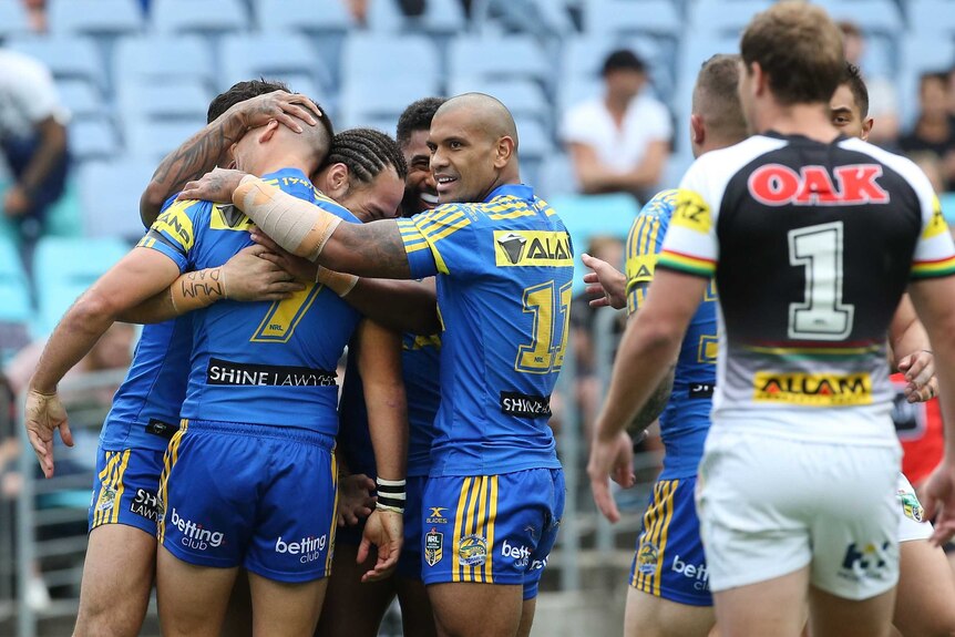 Parramatta Eels celebrate a try against the Panthers