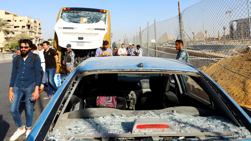 A damaged bus is seen at the site of a blast near a new museum being built close to the Giza pyramids in Cairo.