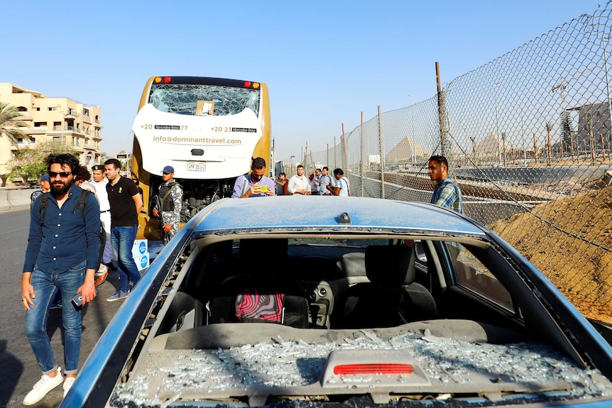 A damaged bus is seen at the site of a blast near a new museum being built close to the Giza pyramids in Cairo.