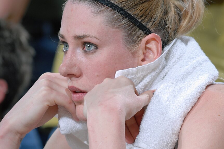 Lauren Jackson sits with a towel around her neck