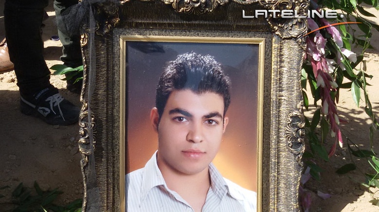 Portrait of Iranian asylum seeker Hamid Khazaei's at his funeral