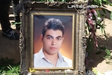 Portrait of Iranian asylum seeker Hamid Khazaei's at his funeral