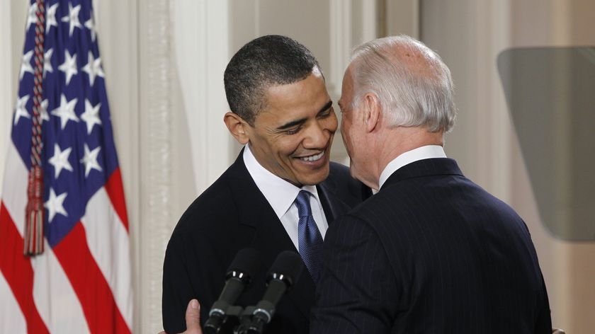 US Vice President Joe Biden (right) whispers a remark to President Barack Obama