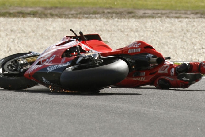 Australia's newly-crowned MotoGP world champion Casey Stoner slides off his bike