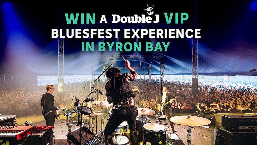 A band plays Bluesfest to a very large crowd. Pic features the words 'Win a Double J VIP Bluesfest Experience In Byron Bay'