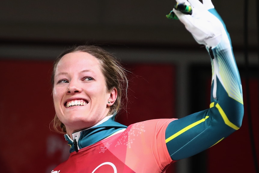 Jackie Narracott waves and smiles after her final run of the Women's Skeleton.