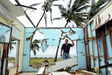 Greville Blank surveys his destroyed home in the devastated in Tully Heads on February 4, 2011.