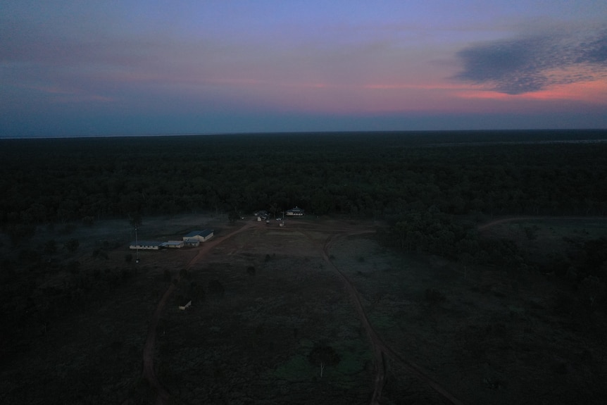 Drone image of Wambiana station home with sun rising in background.