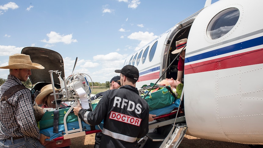 Patient being loaded onto an RFDS plane.