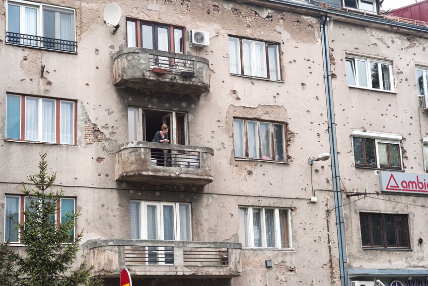 A building in Sarajevo with bullet holes, 20 years after the siege.