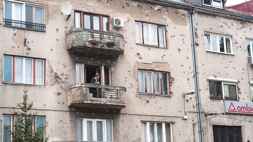 A building in Sarajevo with bullet holes, 20 years after the siege.