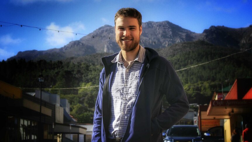 Dr Rob Dickson standing in a street in Queenstown