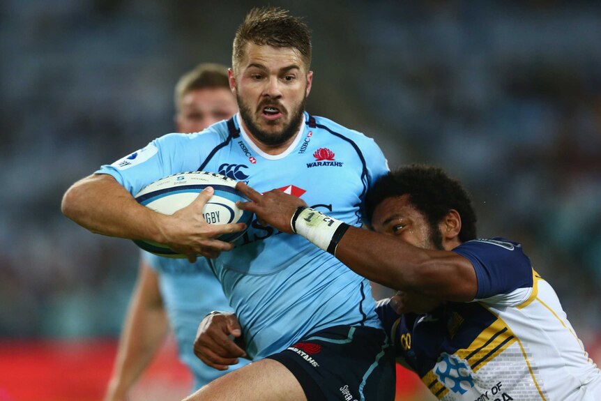 Tight tussle ... Drew Mitchell tries to beat the defence of Henry Speight