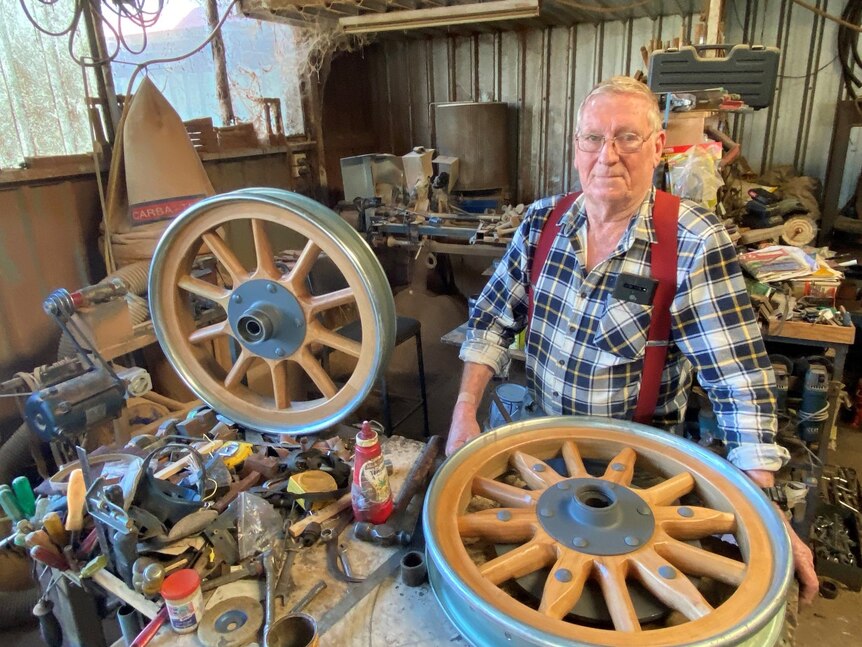 Wooden spoke wheel maker Keith Wilson in his shed in Allora