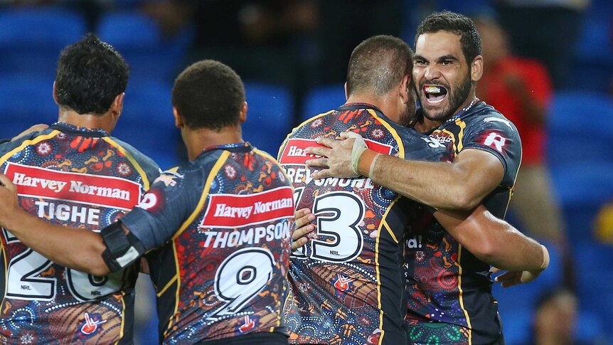 Team effort ... Greg Inglis celebrates a try for the Indigenous All Stars