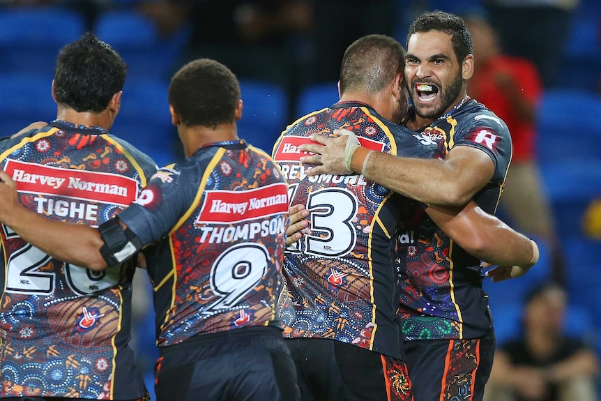 Team effort ... Greg Inglis celebrates a try for the Indigenous All Stars