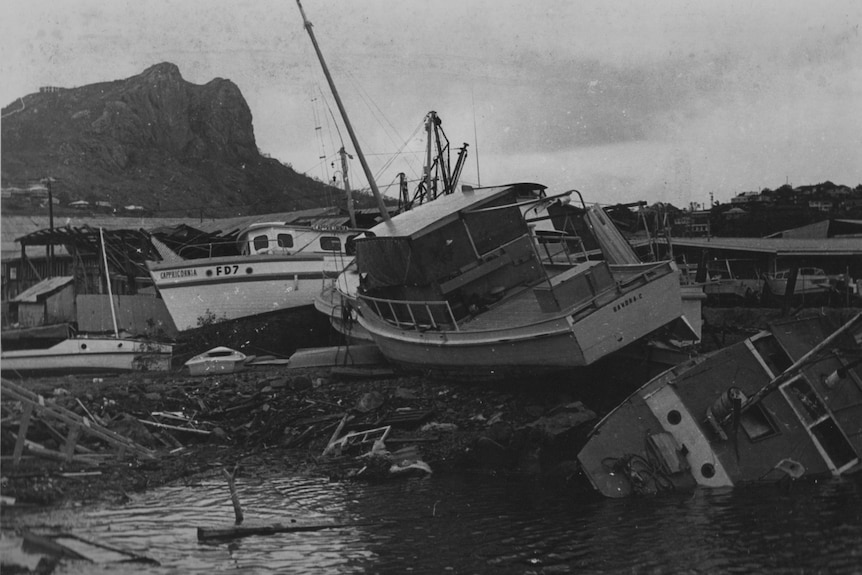 Black and white pictures of boats washed ashore