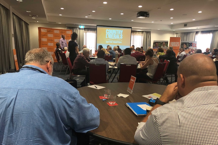 Several circular tables are full at the NT Country Liberal Party's central council meeting.