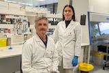 Brendan Chapman and Ruby Dixon wearing white lab coats in a portrait taken inside a Murdoch lab 