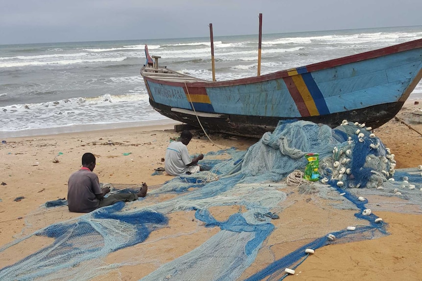 Fishing nets being repaired on the Ghana Coastline