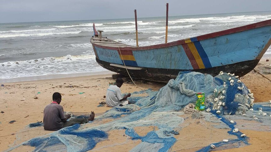 Fishing nets being repaired on the Ghana Coastline