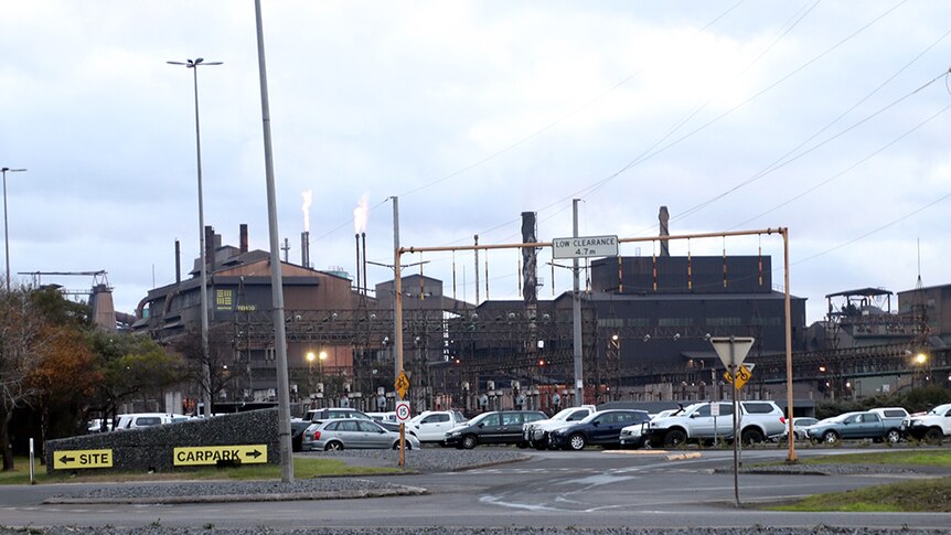 Workers cars in front of the TEMCO smelter