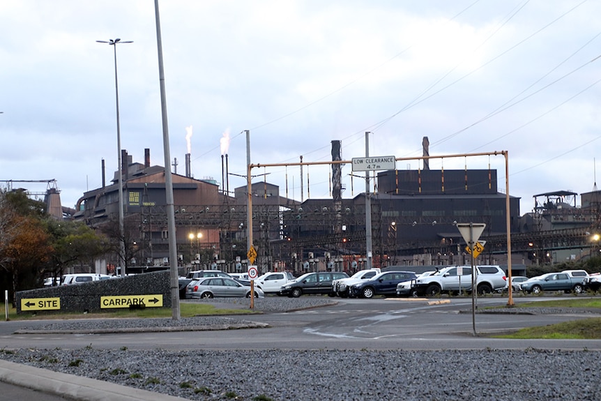 Workers cars in front of the TEMCO smelter