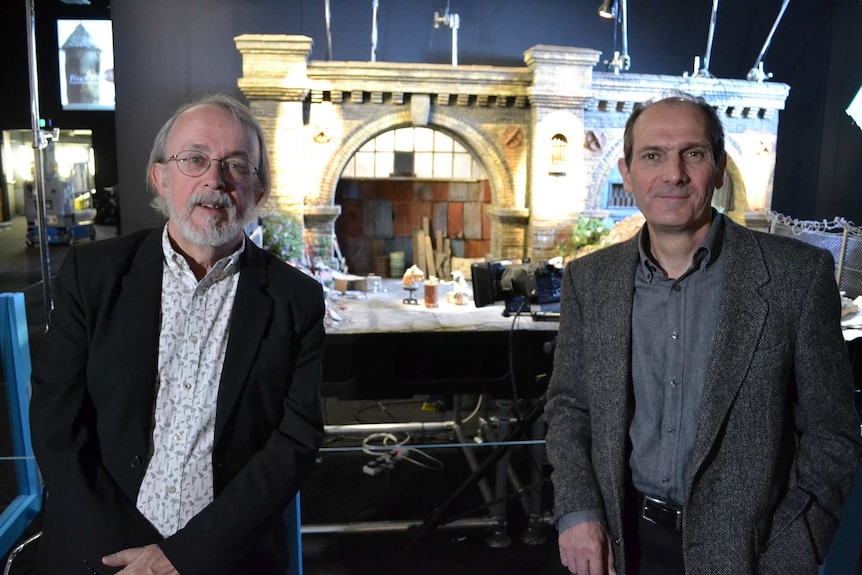 Peter Lord and David Sproxton sitting at Wallace and Gromit and Shaun the Sheep exhibition at ACMI.