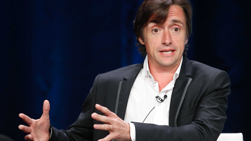 Television presenter Richard Hammond gestures as he speaks at an event.