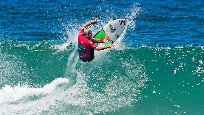 Owen Wright surfs a wave in his comeback appearance at Merewether Beach.