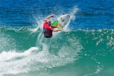 Owen Wright surfs a wave in his comeback appearance at Merewether Beach.