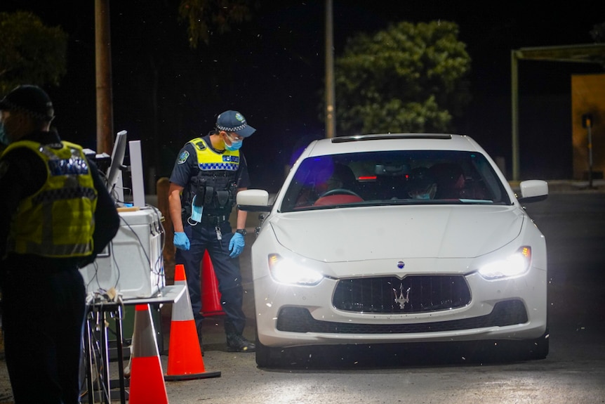 A car at a border COVID-19 checkpoint.