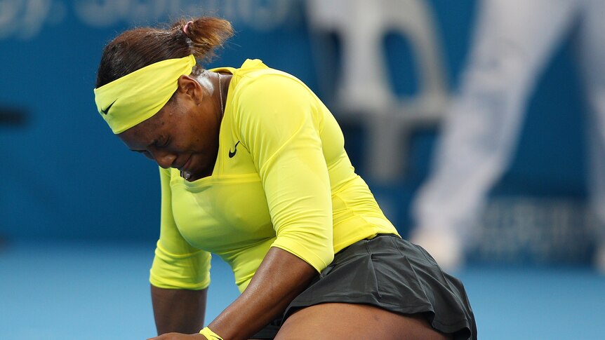 Injury scare ... Serena Williams grimaces in pain on Pat Rafter Arena (Chris Hyde: Getty Images)